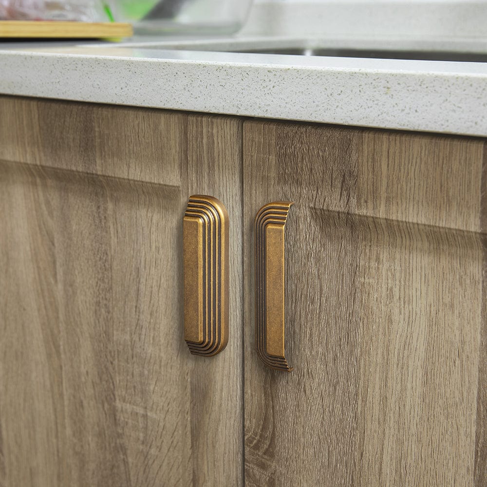 Antique Brass Cup Pulls Multi-Sectioned Ribbed Design for Classic Drawer